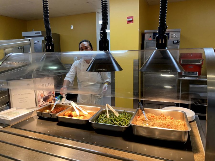 Hot meal options on September 24, 2021 at Wilton High School feature rice, chicken, and green beans.