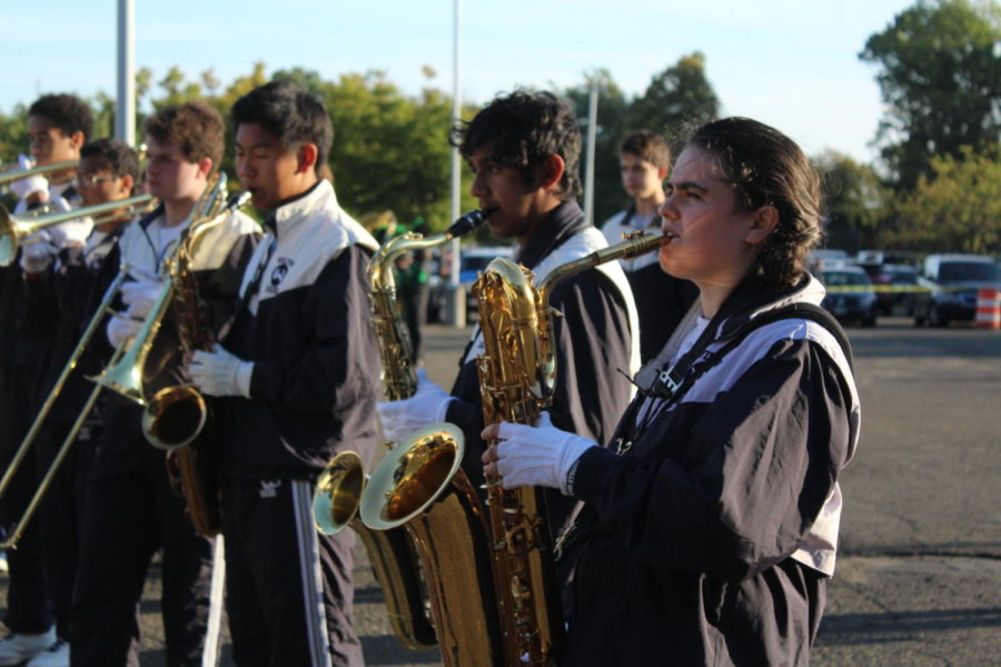 The tenor saxophones and low brass section of the Wilton High School Band rehearse their marching show, titled “Life on Mars”.  