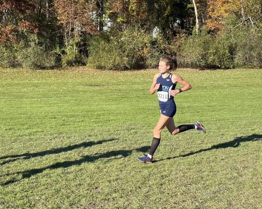Emily Mrakovcic, captain of the Wilton High School girls’ cross country team, runs a final race on the CIAC State Open course on her road to the New England Championships. 