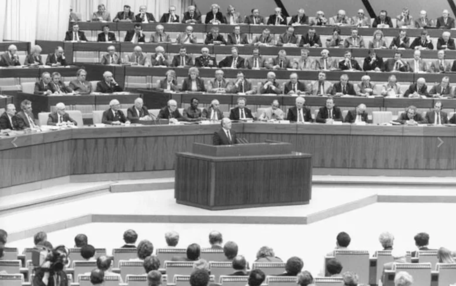 Gorbachev+addresses+the+attendees+of+the+11th+congress+of+the+Socialist+Unity+party+of+Germany+in+April+1986.+